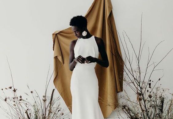 dark-skinned bride in a white dress