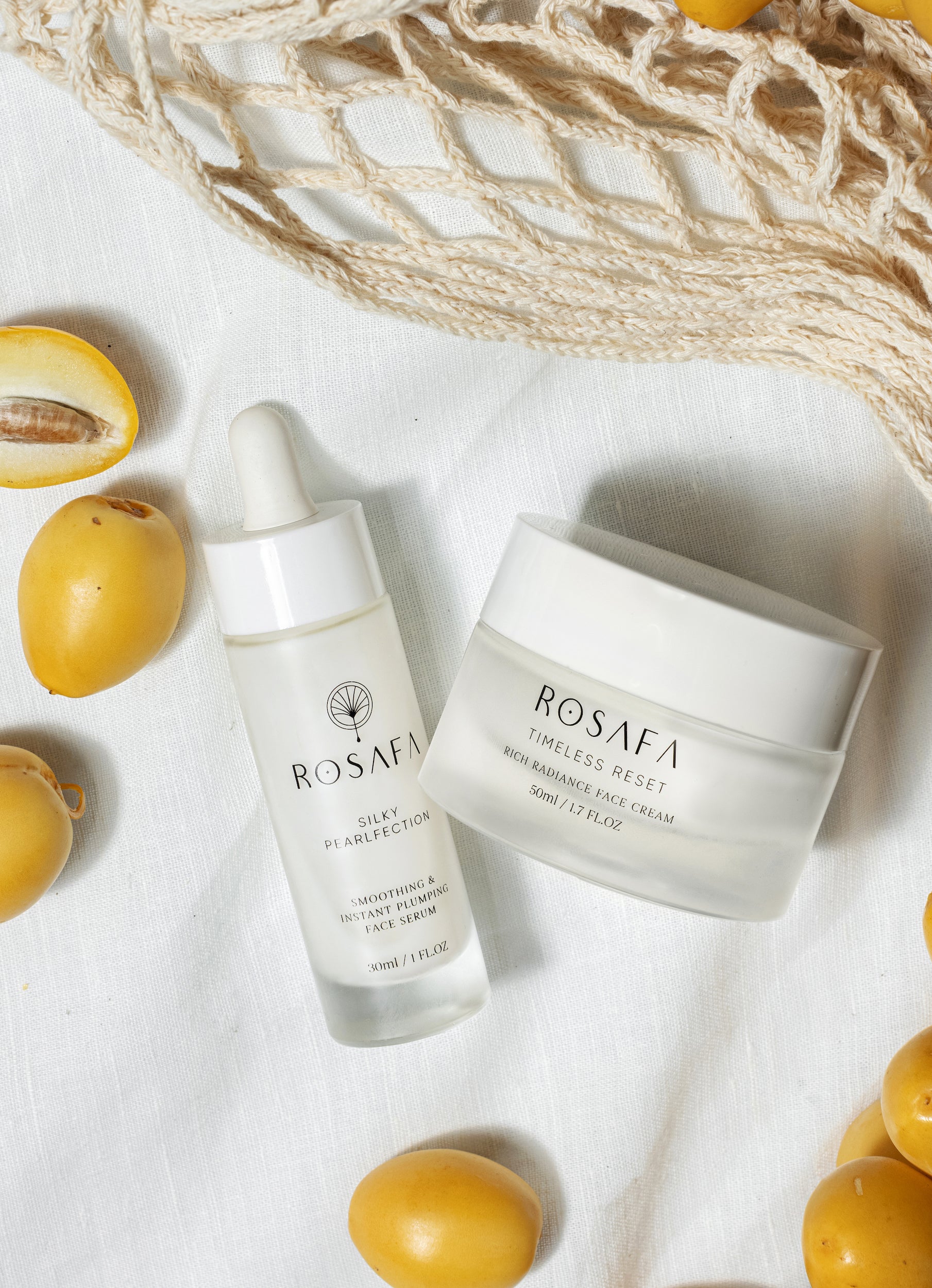 rosafa skincare products next to the date fruit on a white background