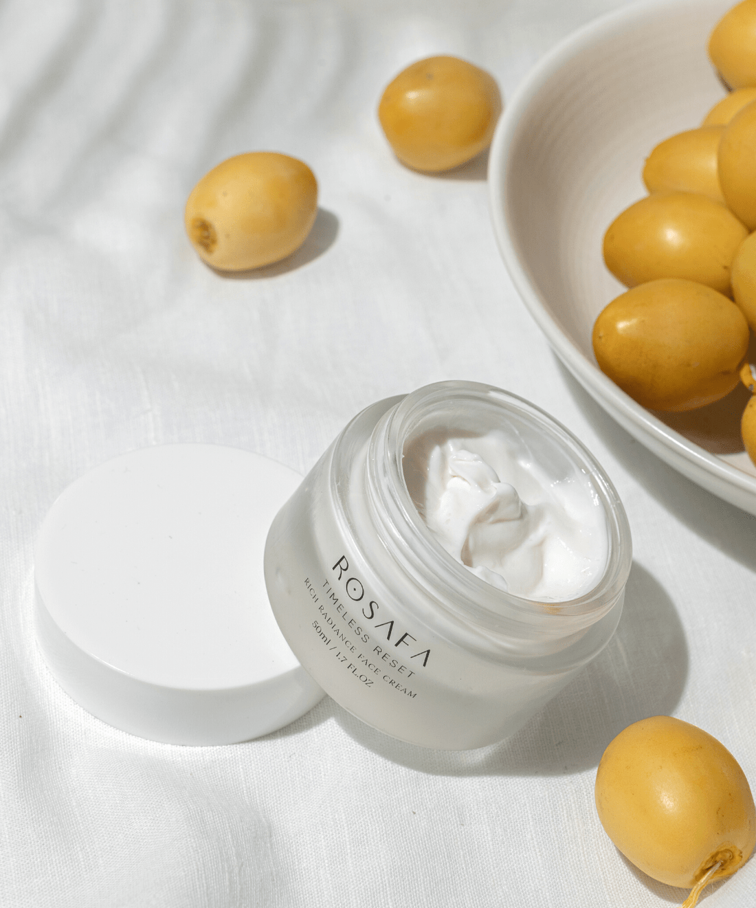 rosafa timeless reset face cream opened with dates in the background